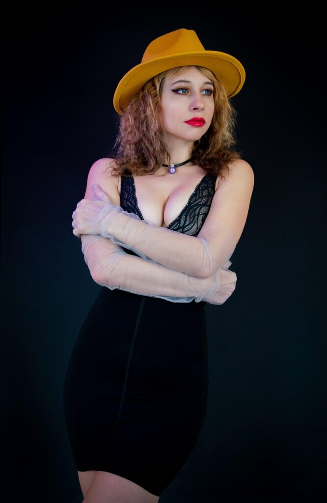 woman, fashion, dress, pose, model, style, femininity, pretty dress, neckline, breast, hat, gloves, small black dress, body, figure, yoke, nice dress